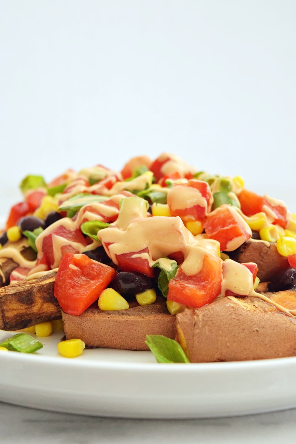 https://sweetvegansara.com/wp-content/uploads/2019/07/Vegan-Loaded-Sweet-Potato-Fries-with-Spicy-Tahini-Dip-7.jpg
